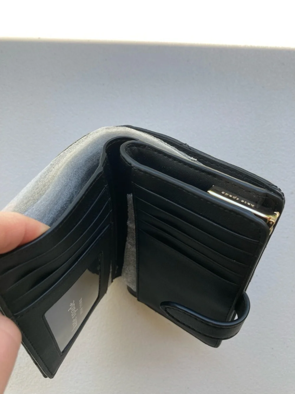 Kate Spade New York Carey Medium Compact Bifold Wallet in Black Quilted Leather